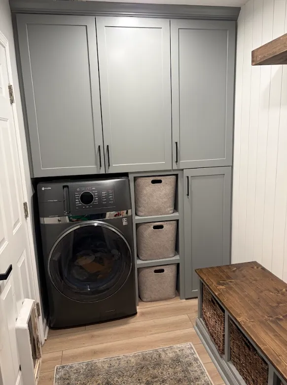 Custom laundry room cabinetry and shelving installed by Picture Perfect HHI