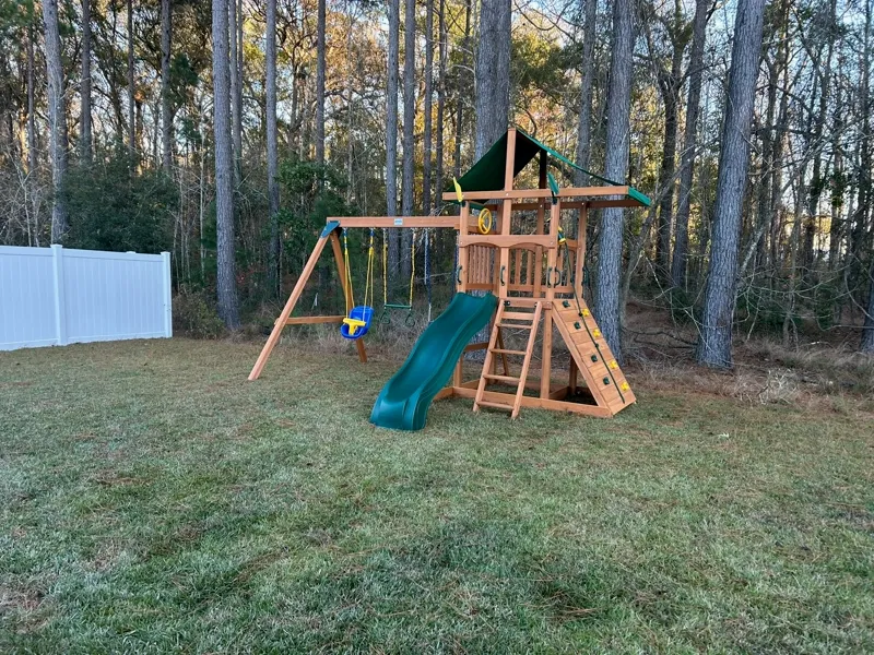 Outdoor playset assembled by Picture Perfect HHI in a backyard